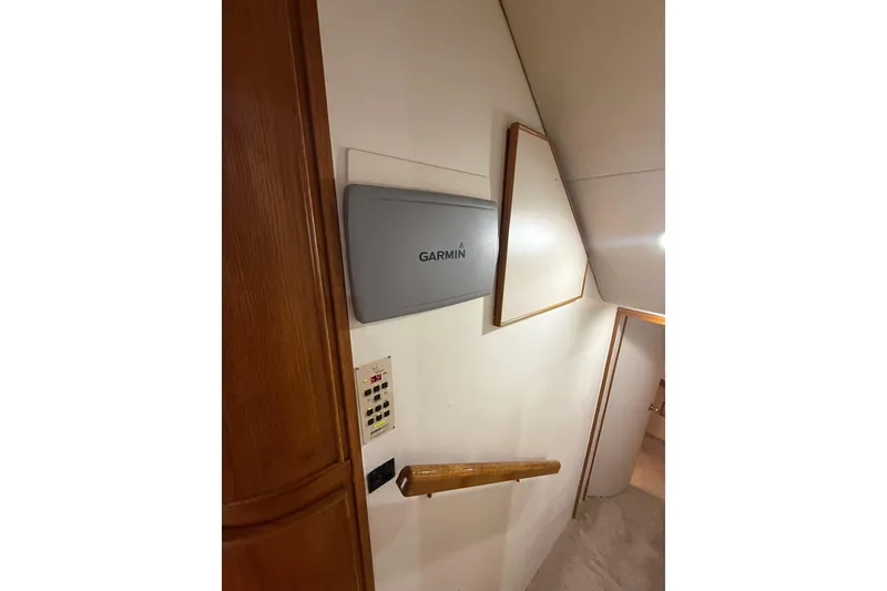 Slide: The Image of Interior of 1988 Bertram 43 Flybridge with Garmin panel and control panel. - 41