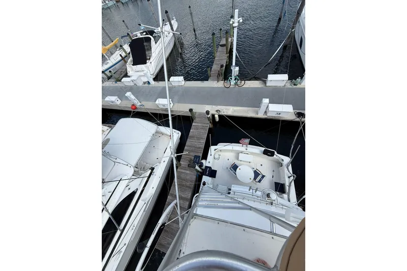 Slide: The Image of Overhead view of 1988 Bertram 43 Flybridge docked at marina. - 80