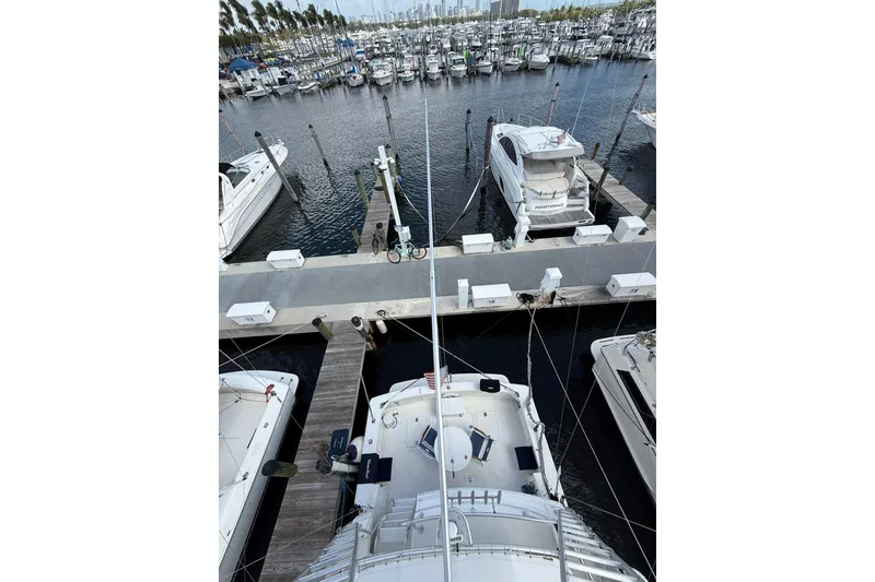 Slide: The Image of Overhead view of 1988 Bertram 43 Flybridge yacht docked at marina. - 81