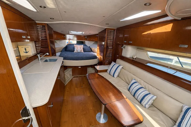 Slide: The Image of Luxurious interior of 2010 Sea Ray Sundancer 370 yacht with cozy seating and elegant wood finishes. - 4