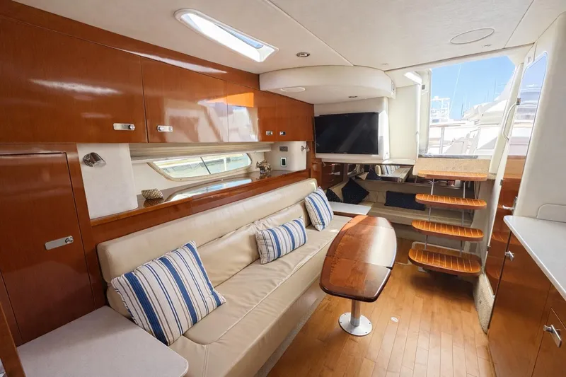 Slide: The Image of Luxurious interior of 2010 Sea Ray Sundancer 370 yacht with elegant wood finishes and plush seating. - 5