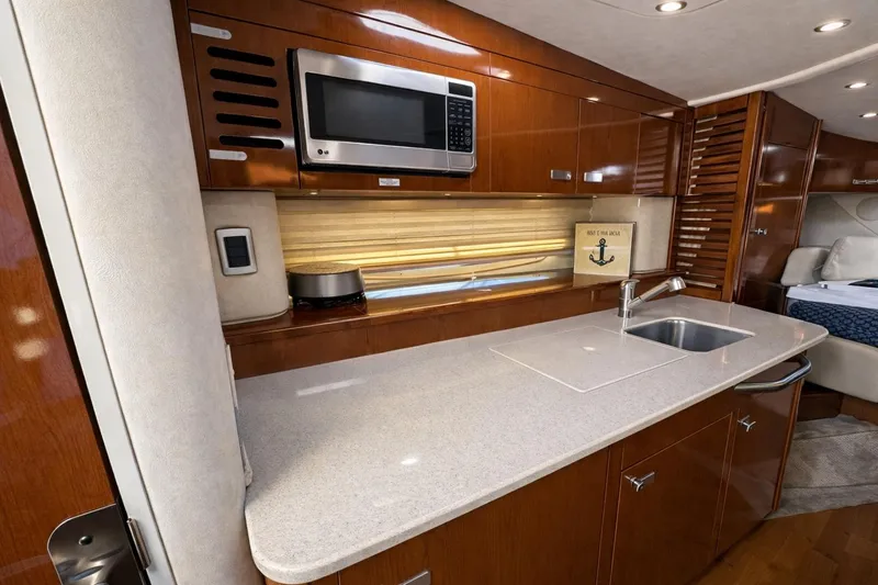 Slide: The Image of Luxurious 2010 Sea Ray Sundancer 370 yacht kitchen with modern amenities and sleek design. - 6