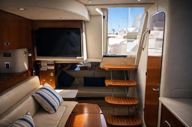 Slide: The Image of Luxurious interior of 2010 Sea Ray Sundancer 370 yacht with TV and wooden accents. - 7