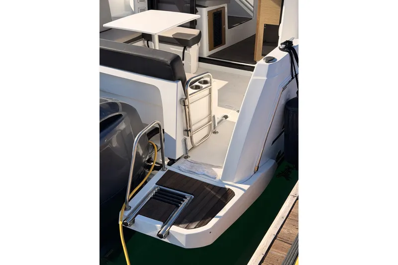 Slide: The Image of 2020 Jeanneau NC 895 boat stern with swim platform and seating area. - 12