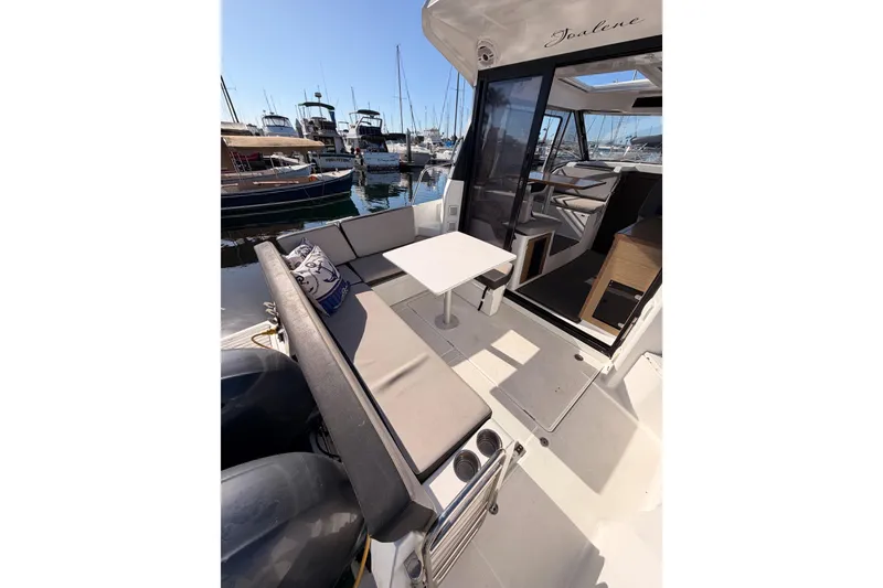 Slide: The Image of 2020 Jeanneau NC 895 boat interior with seating and table, docked at marina. - 15
