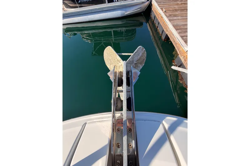 Slide: The Image of Bow view of 2020 Jeanneau NC 895 with anchor, docked in calm water. - 22