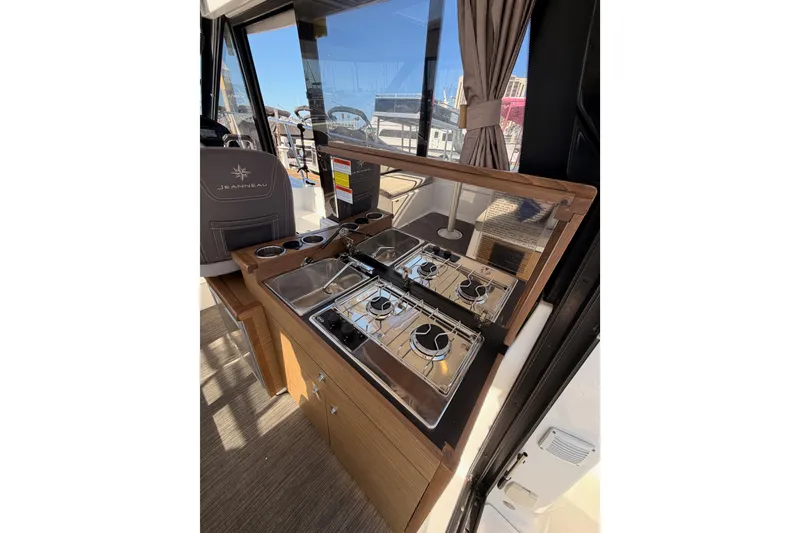 Slide: The Image of Interior of 2020 Jeanneau NC 895 boat featuring a compact kitchen area. - 40