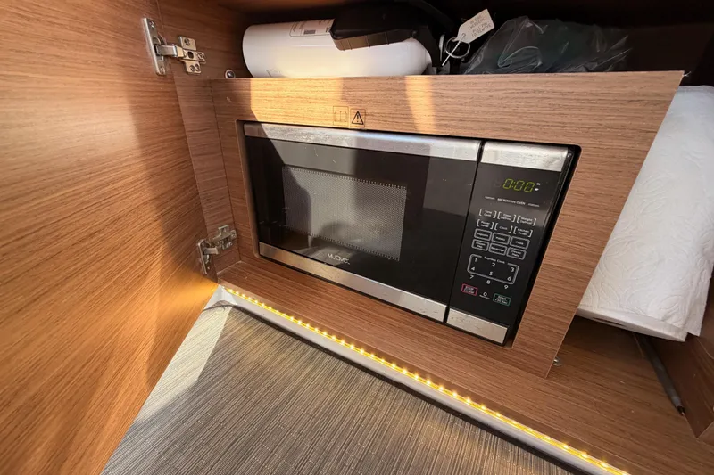 Slide: The Image of Built-in microwave in Jeanneau NC 895 boat, 2020 model, with wood cabinetry. - 41