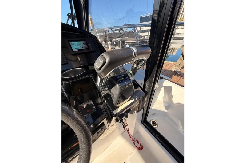 Slide: The Image of 2020 Jeanneau NC 895 boat cockpit with steering wheel and control panel. - 51