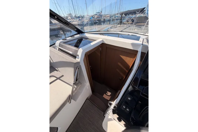 Slide: The Image of 2020 Jeanneau NC 895 boat interior with cabin entrance and marina view. - 56