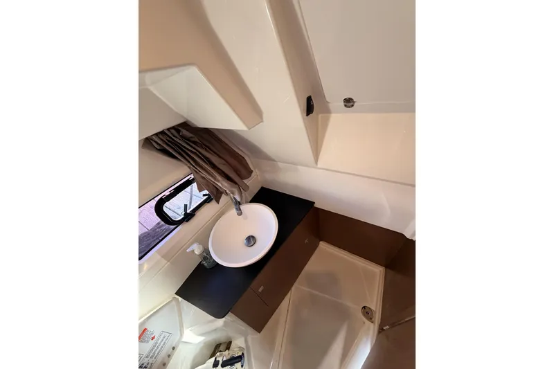 Slide: The Image of 2020 Jeanneau NC 895 bathroom interior with sink and window. - 61