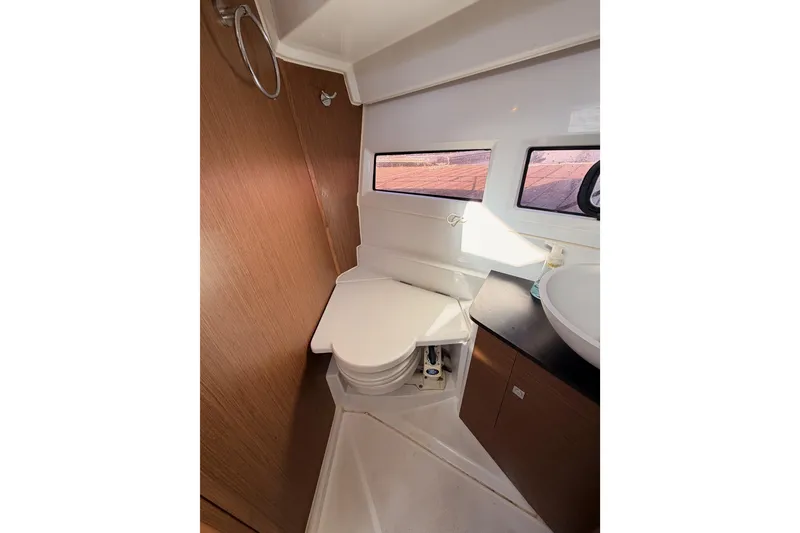 Slide: The Image of Interior of 2020 Jeanneau NC 895 boat bathroom with toilet and sink. - 63
