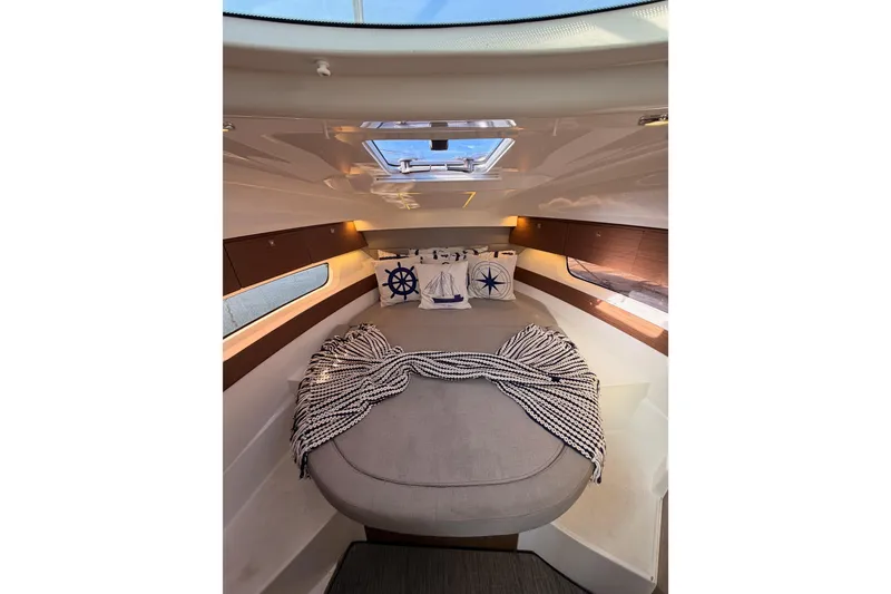 Slide: The Image of Cozy interior cabin of 2020 Jeanneau NC 895 with nautical-themed decor. - 70