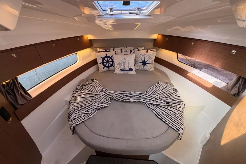 Slide: The Image of Luxurious interior cabin of 2020 Jeanneau NC 895 with nautical-themed decor. - 71