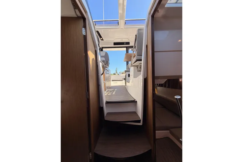 Slide: The Image of Interior view of 2020 Jeanneau NC 895 boat, showcasing modern design and spacious layout. - 76