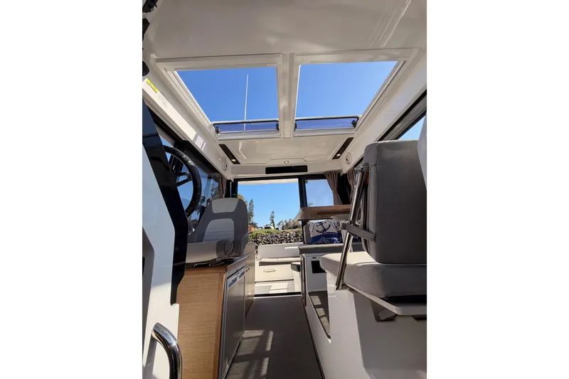 Slide: The Image of Interior view of 2020 Jeanneau NC 895 boat with skylights and seating. - 77