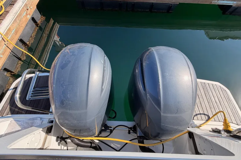 Slide: The Image of 2020 Jeanneau NC 895 boat with dual outboard motors at dock. - 82