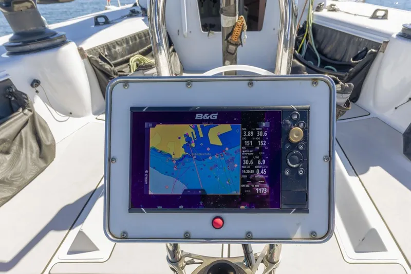Slide: The Image of Boat navigation system on a 2007 Rogers 46, displaying nautical chart and data. - 14