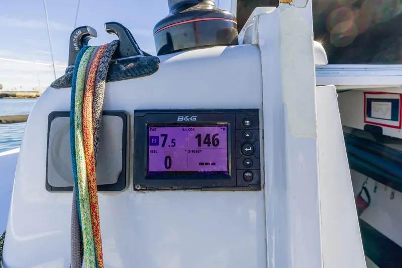 Slide: The Image of Sailing yacht Rogers 46 cockpit with navigation display, colorful ropes, and winch, 2007 model. - 15