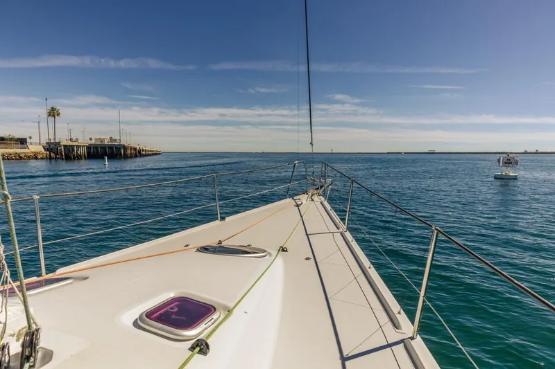 Slide: The Image of Sailing on a 2007 Rogers 46 yacht in calm blue waters under a clear sky. - 23