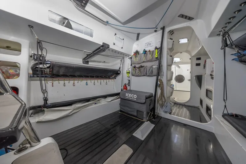Slide: The Image of Interior of 2007 Rogers 46 sailboat, featuring organized storage and modern equipment. - 26