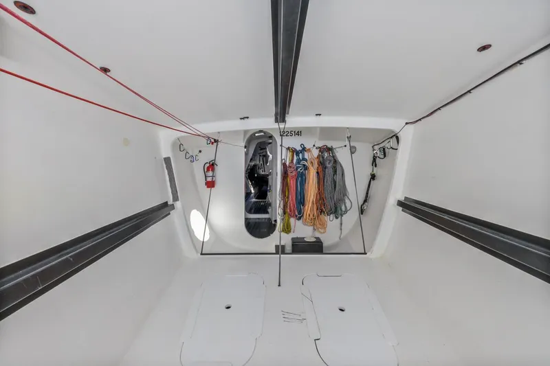 Slide: The Image of Interior of 2007 Rogers 46 sailboat with organized ropes and sleek design. - 32
