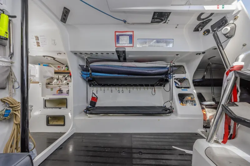 Slide: The Image of Interior of 2007 Rogers 46 sailboat with bunk beds and storage compartments. - 33