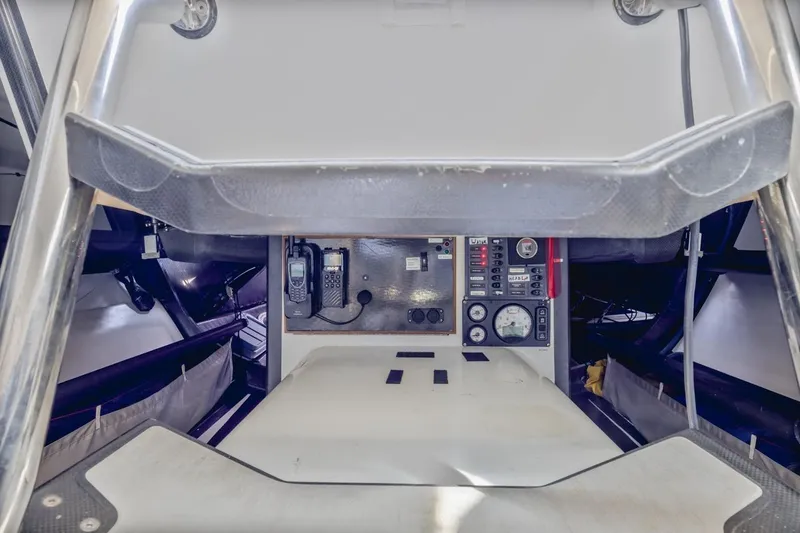 Slide: The Image of Interior view of a 2007 Rogers 46 yacht, featuring navigation equipment and control panel. - 35