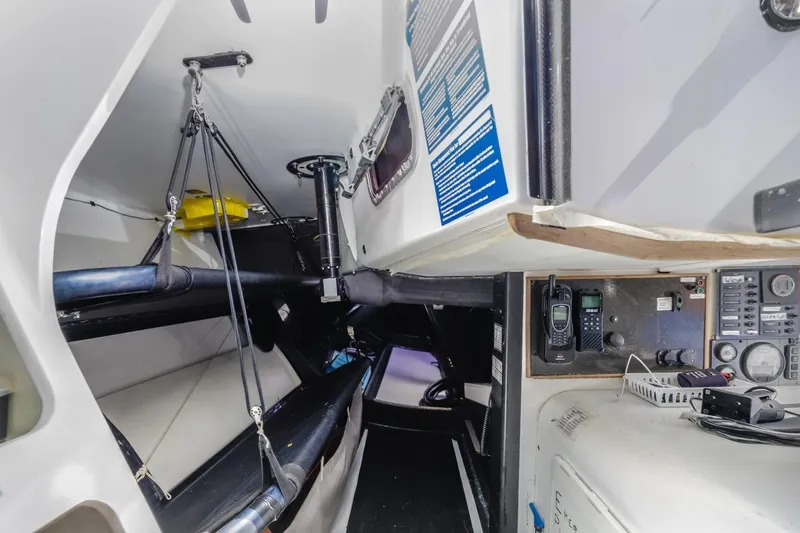 Slide: The Image of Interior of 2007 Rogers 46 sailboat with navigation equipment and sleeping berths. - 37
