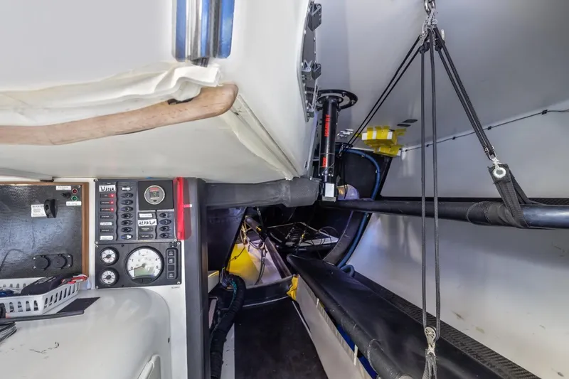 Slide: The Image of Interior of a 2007 Rogers 46 sailboat, featuring control panel and rigging. - 39