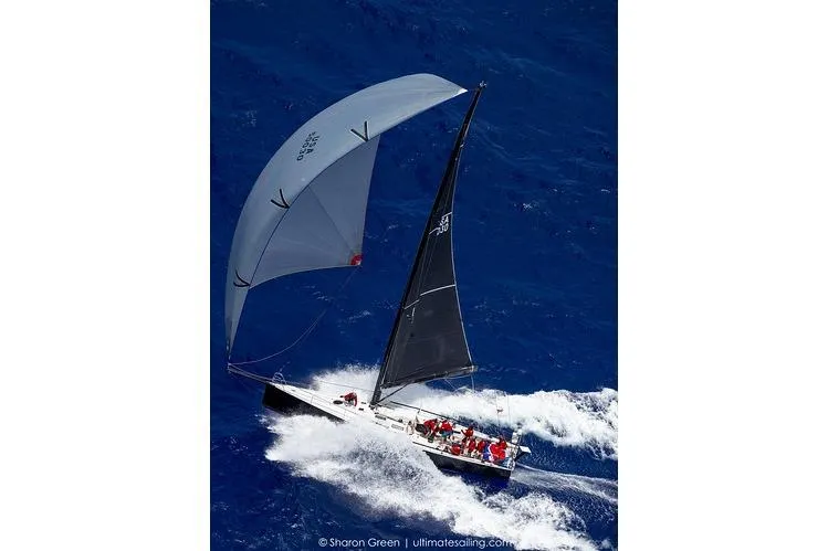 Slide: The Image of Sailboat Rogers 46, 2007 model, navigating through vibrant blue ocean waves. - 43