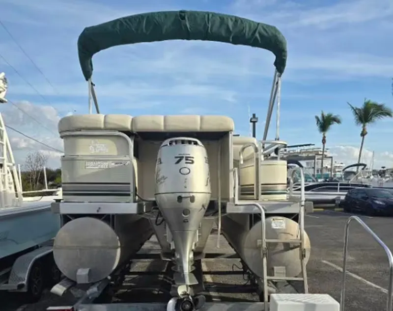 Slide: The Image of Bennington 2050 LX 2001 boat seat with steering wheel and upholstery. - 3