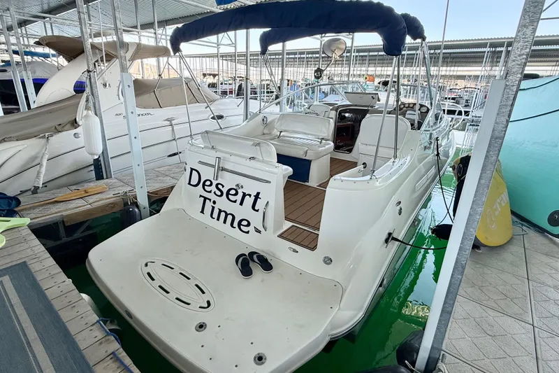 The Image of 2003 Bayliner 265 boat named "Desert Time" docked in a marina. - 0