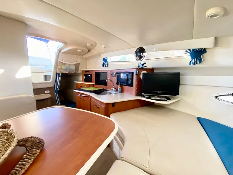 Slide: The Image of Interior of a 2003 Bayliner 265 yacht with modern amenities. - 19