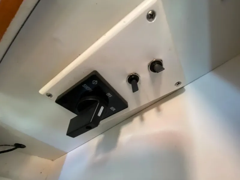 Slide: The Image of Switch panel of a 2003 Bayliner 265 yacht. - 27