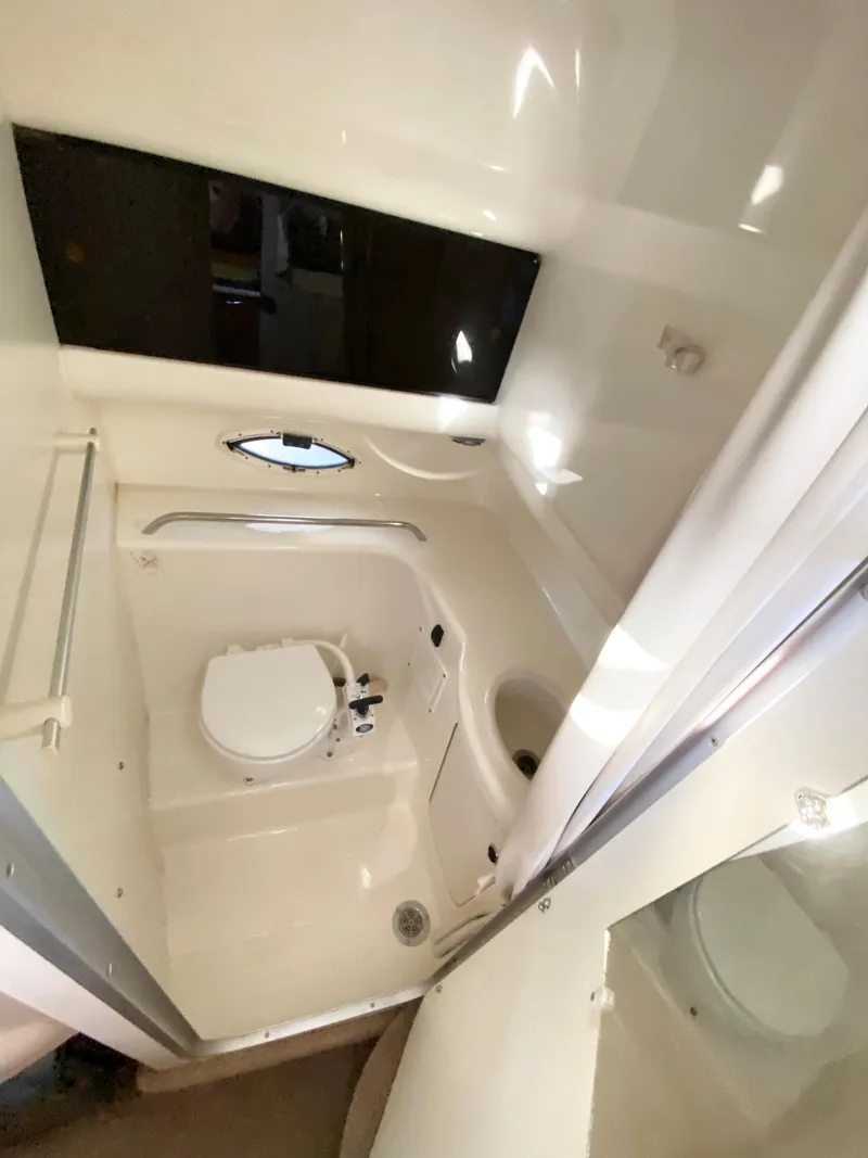 Slide: The Image of Interior view of 2003 Bayliner 265, bathroom with toilet. - 28