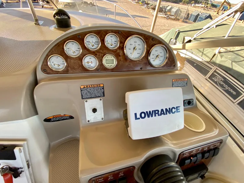 Slide: The Image of Dashboard of a 2003 Bayliner 265 boat with Lowrance device. - 30