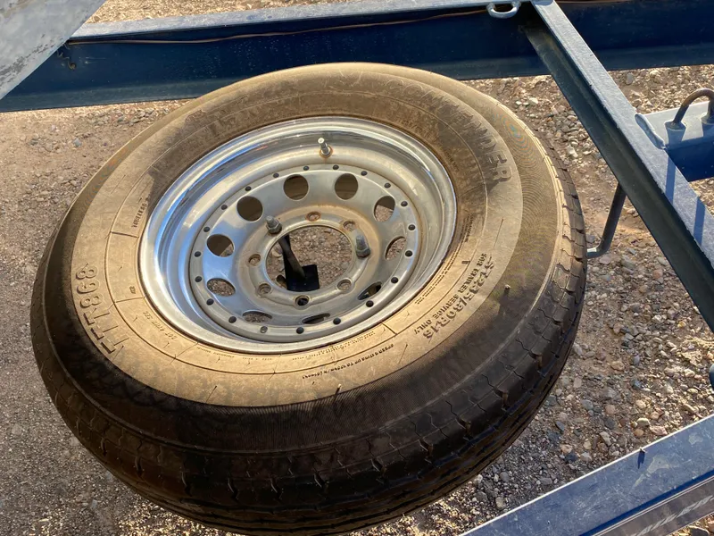 Slide: The Image of Spare tire on trailer for 2003 Bayliner 265 boat. - 32