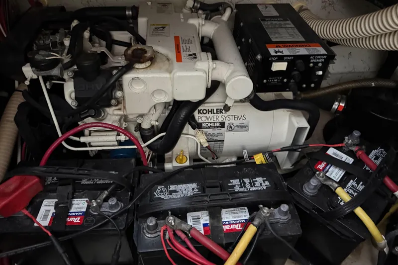 Slide: The Image of Engine compartment of a 2003 Bayliner 265 with Kohler power system and batteries. - 36