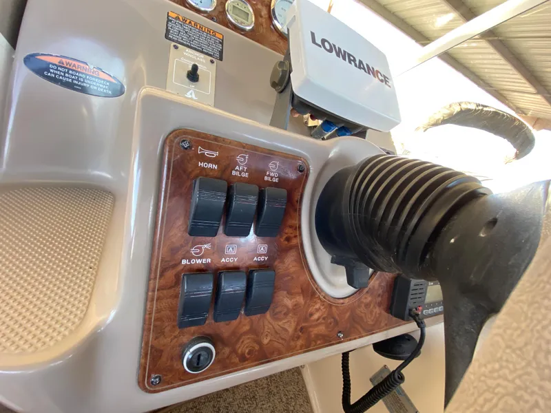 Slide: The Image of Dashboard of a 2003 Bayliner 265 boat with Lowrance device. - 6