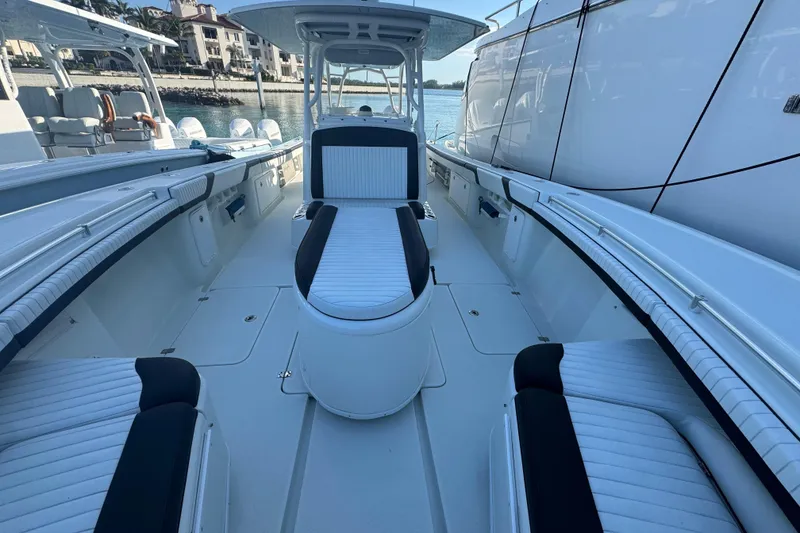 Slide: The Image of 2014 Yellowfin 39 Offshore boat interior with sleek seating and modern design. - 12