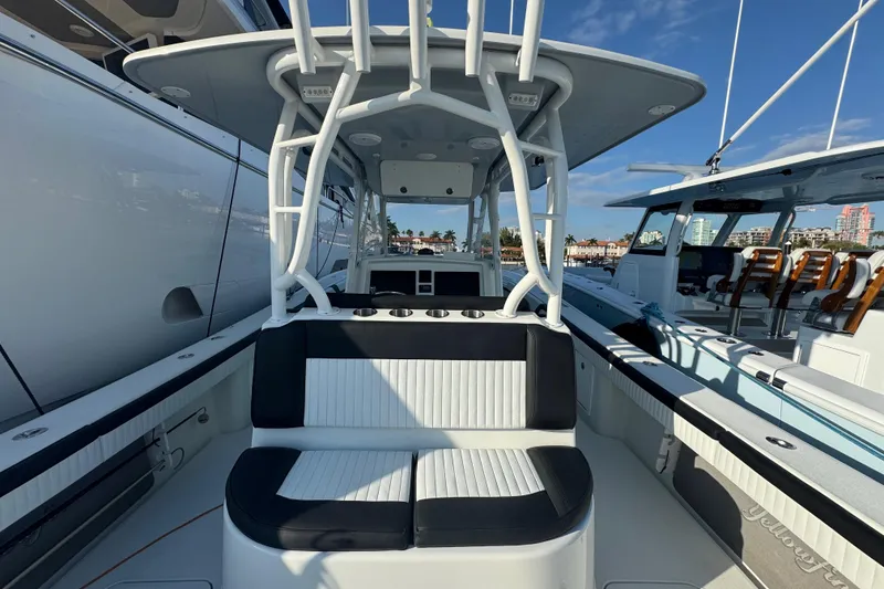 Slide: The Image of 2014 Yellowfin 39 Offshore boat interior with seating and helm station. - 18