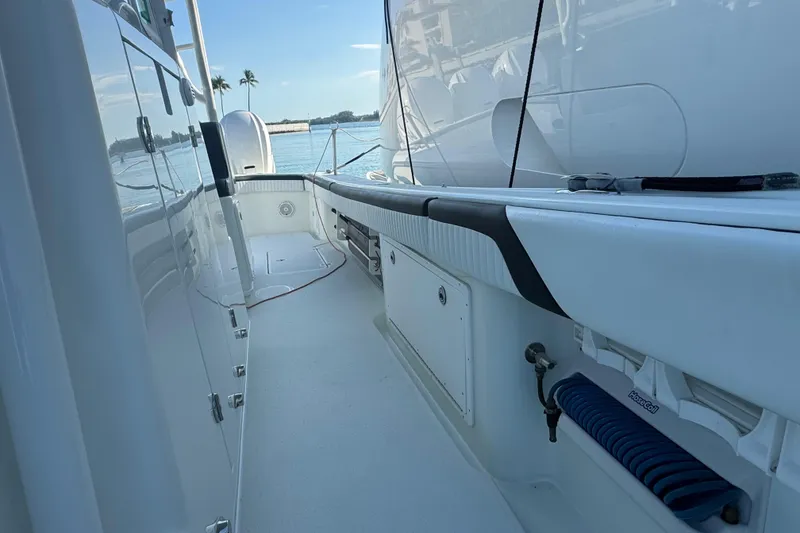 Slide: The Image of 2014 Yellowfin 39 Offshore boat deck with ocean view and palm trees. - 21