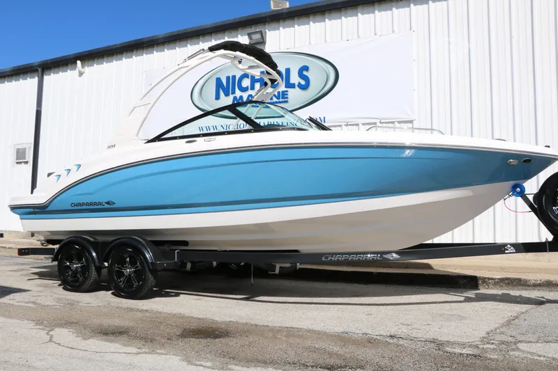 The Image of 2026 Chaparral 23 SSi boat on trailer in front of building. - 1