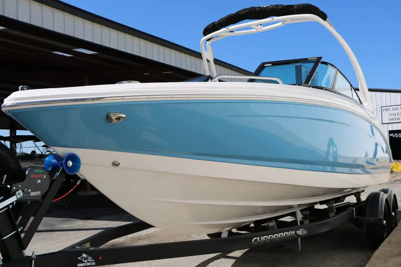 Slide: The Image of 2026 Chaparral 23 SSi boat on trailer, blue and white design. - 5