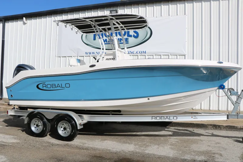 The Image of 2026 Robalo R200 Center Console boat on trailer. - 1