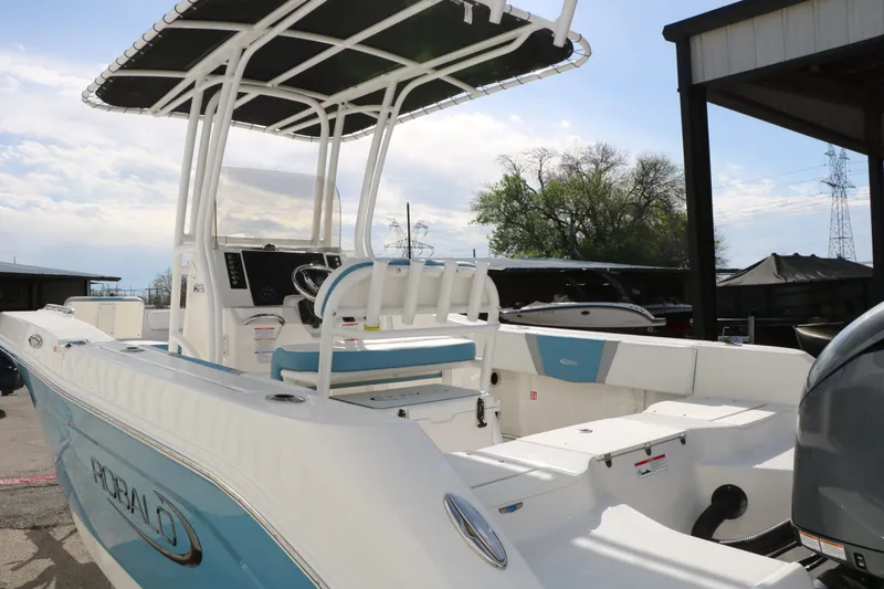 Slide: The Image of 2026 Robalo R200 Center Console boat docked at marina. - 12