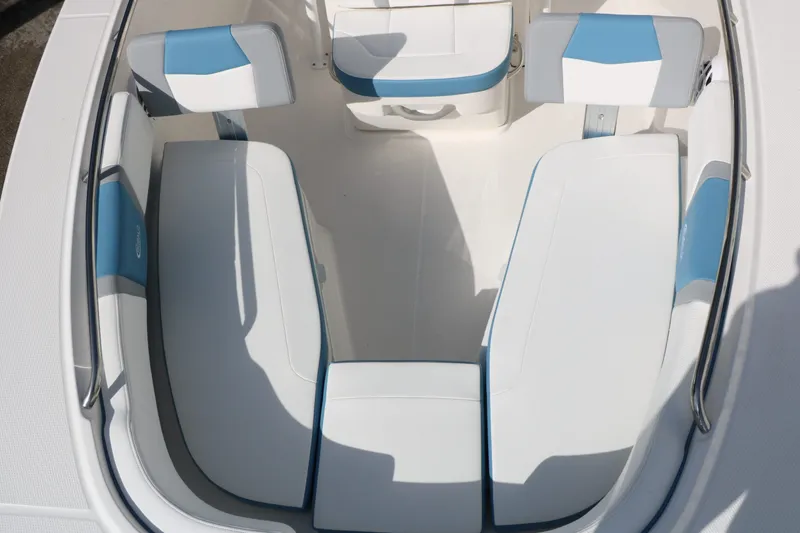 Slide: The Image of Interior view of 2026 Robalo R200 Center Console with blue and white seating. - 23