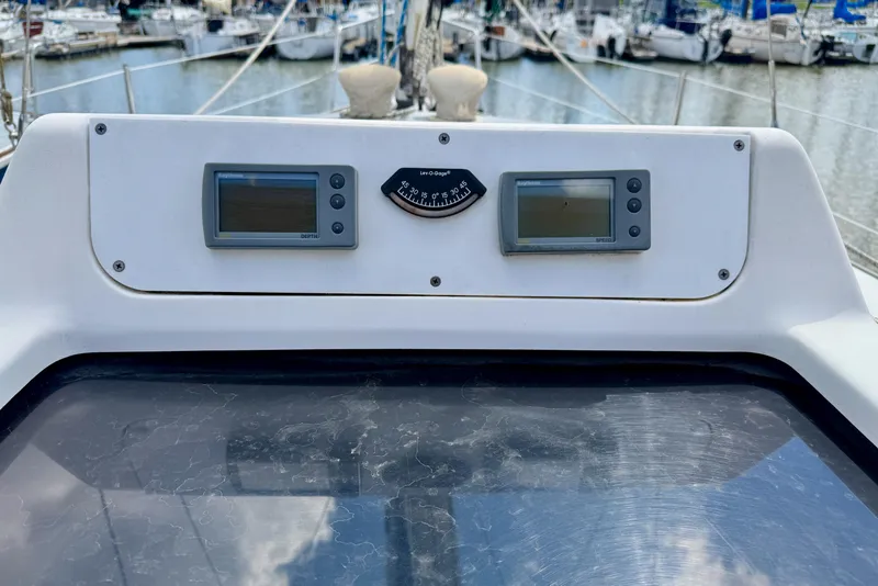 Slide: The Image of Control panel of a 2001 Hunter 320 sailboat with navigation instruments. - 12
