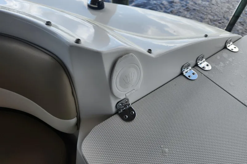 Slide: The Image of 2018 Stingray 235 LR boat interior with speaker and seating detail. - 29